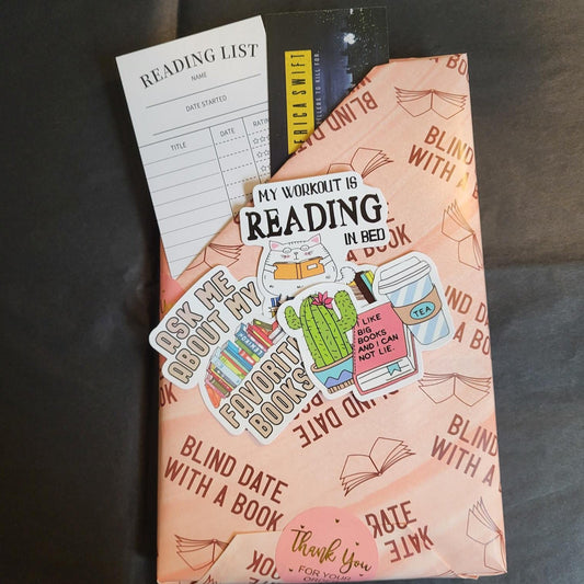 Blind date with a book wrapped in blind date wrapping paper and with bookmarks and stickers